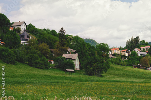 village on the green hills in the Alps mountains. Europe. Slovenia. Rural landscape.