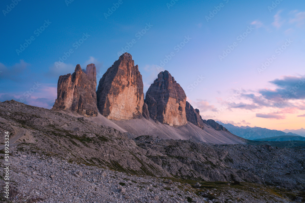 Stunning view of the Three Peaks of Lavaredo, (Tre cime di Lavaredo) during a beautiful sunset. The Three Peaks of Lavaredo are the undisputed symbol of the Dolomites, Italy.