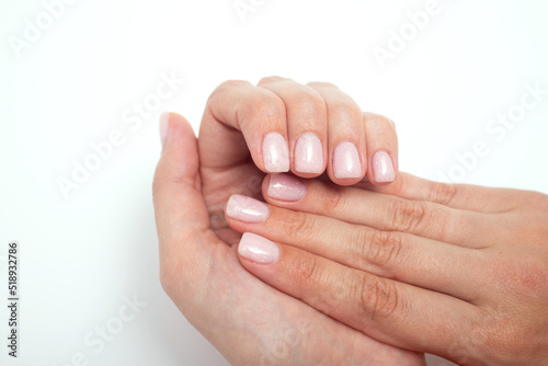 Woman french manicure on trendy pink