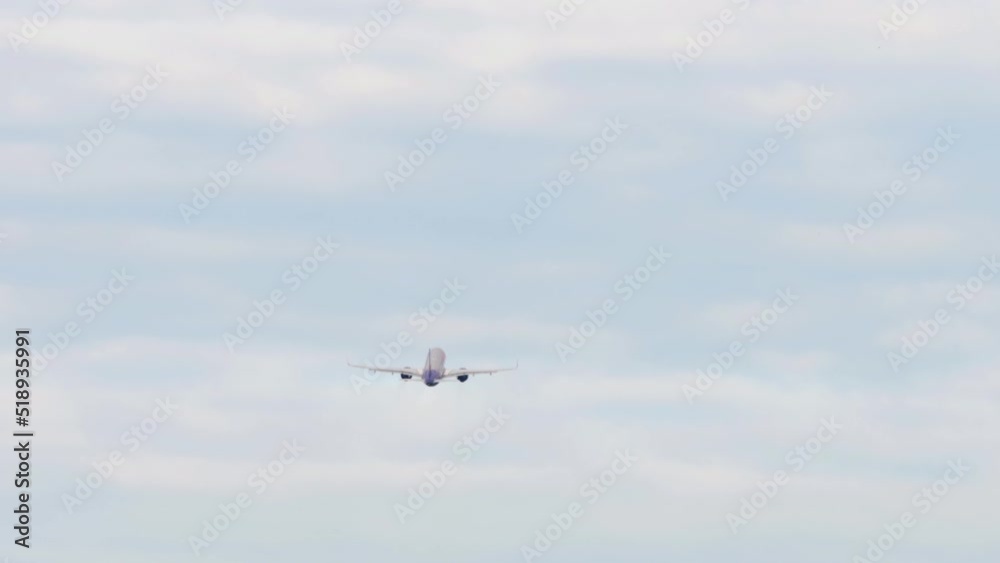 Jet plane taking off and gaining altitude in the cloudy sky in the early morning. Tourism and travel concept Jet plane taking off and gaining altitude in the cloudy sky in the early morning. Tourism and travel concept