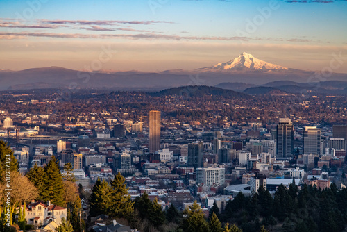 The city of Portland at sunset, as seen toward east and Mt. Hood towering oil the background