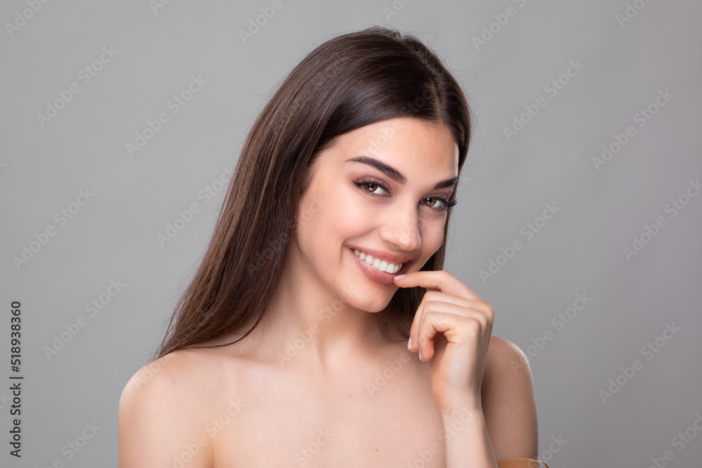 Beautiful young woman with perfect skin. Portrait of beauty model with natural nude make up and touching her face. Spa, skincare and wellness. Close up, copyspace. Stock photo Beautiful young woman with perfect skin. Portrait of beauty model with natural nude make up and touching her face. Spa, skincare and wellness. Close up, copyspace. Stock photo