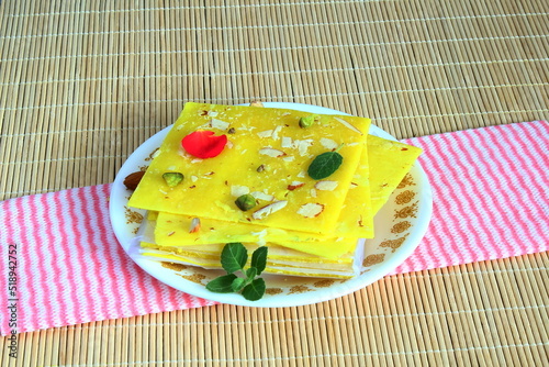 indian gujarati traditional sweet or mithai mumbai ice halwa in dish with dry fruit garnish photo