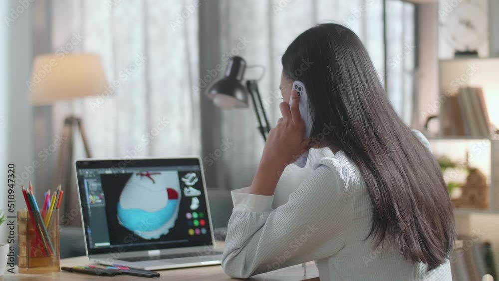 Asian Female Footwear Designer Talking On Smartphone While Designing Shoe On A Laptop At Home. Shoe Production Procedure Concept
Asian Female Footwear Designer Talking On Smartphone While Designing Shoe On A Laptop At Home. Shoe Production Procedure Concept