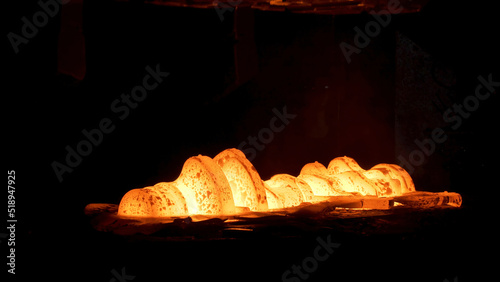 Steel quenching at high temperature in industrial furnace at the workshop of a forge plant. Scene. Process of cooling, heat treatmen, blacksmith and metallurgical industry, steelmaking.