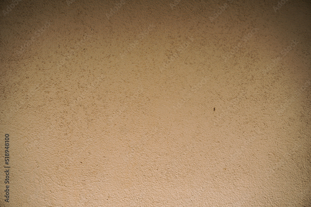 Destroyed cracked wall background, brown light texture, paint streaks.