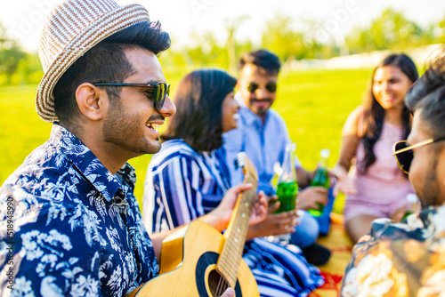 oriental ethnic cheerful friends at pic-nic in sammer park