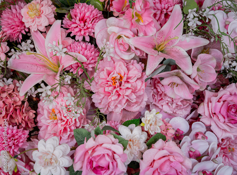 Big bouquet of flowers in a vase on a gray wall background Big bouquet of flowers in a vase on a gray wall background