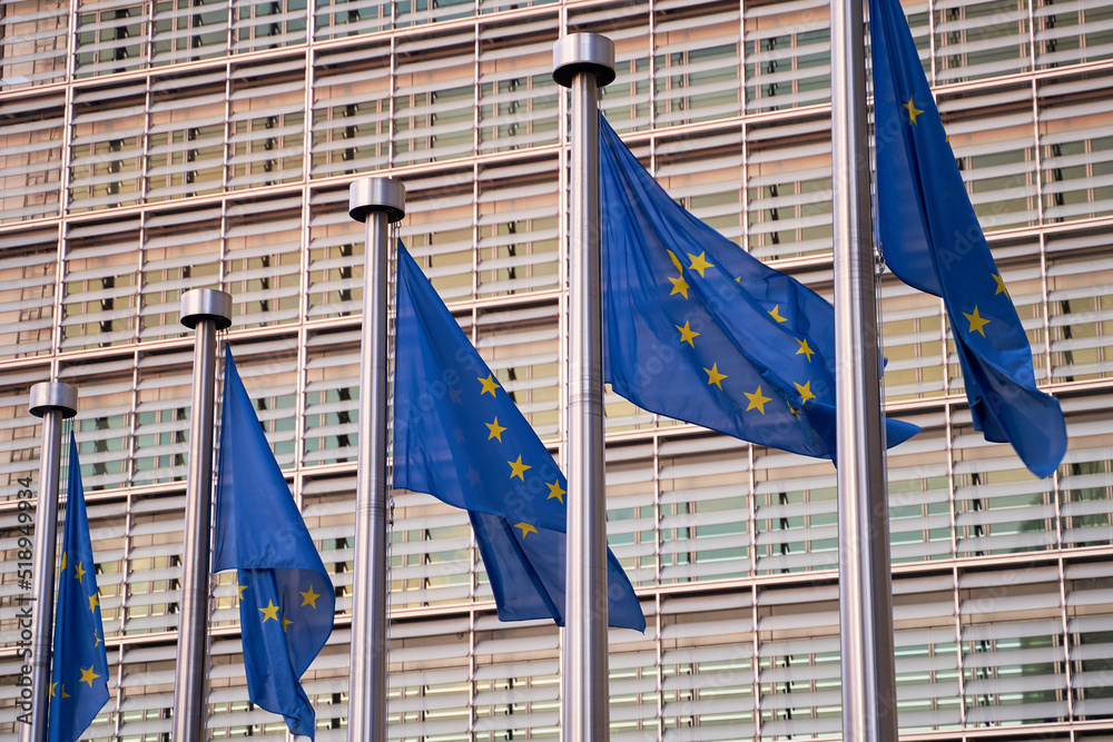 European Union EU flags waving in front of the European Commission building