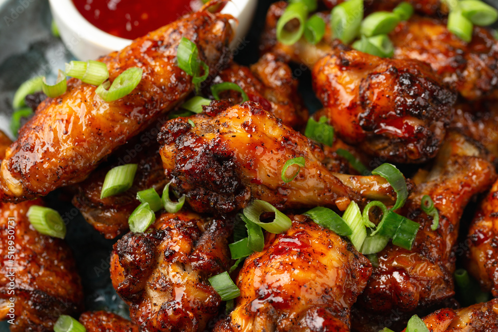 Baked chicken wings with spring onion and sweet chili sauce. Baked chicken wings with spring onion and sweet chili sauce.