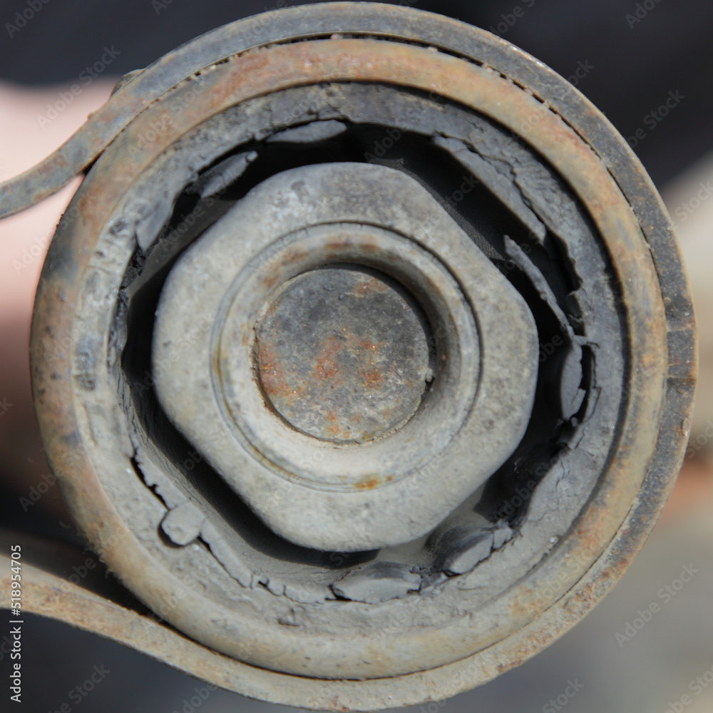Old damaged metal rubber mounting silent block closeup Old damaged metal rubber mounting silent block closeup