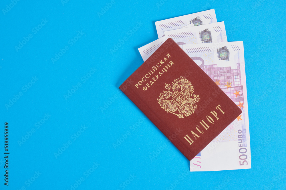 several 500 euro banknotes in the passport of a citizen of Russia, travel and saving money concept several 500 euro banknotes in the passport of a citizen of Russia, travel and saving money concept