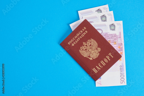 several 500 euro banknotes in the passport of a citizen of Russia, travel and saving money concept