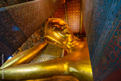 Golden reclining buddha statue in pagoda sightseeing travel