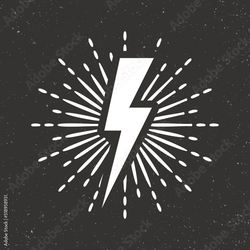 Vintage lightning bolt and sun rays on grunge background. Lightnings with sunburst effect. Thunderbolt, electric shock sign. Vector illustration