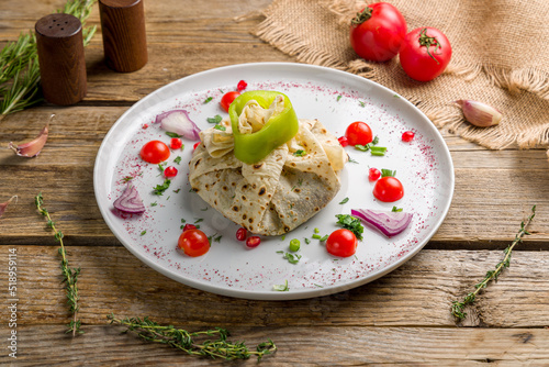 govurma in Baku on white plate on old wooden table photo