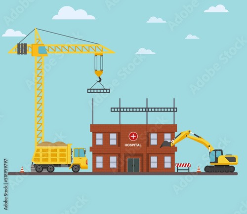 construction site with cranes tractor and bulldozer unfinished building