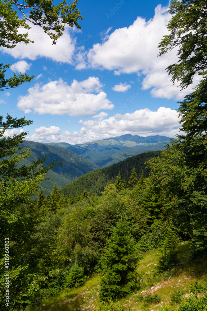 Portrait view over Parang Mountains, Romania with clouds on a summer day