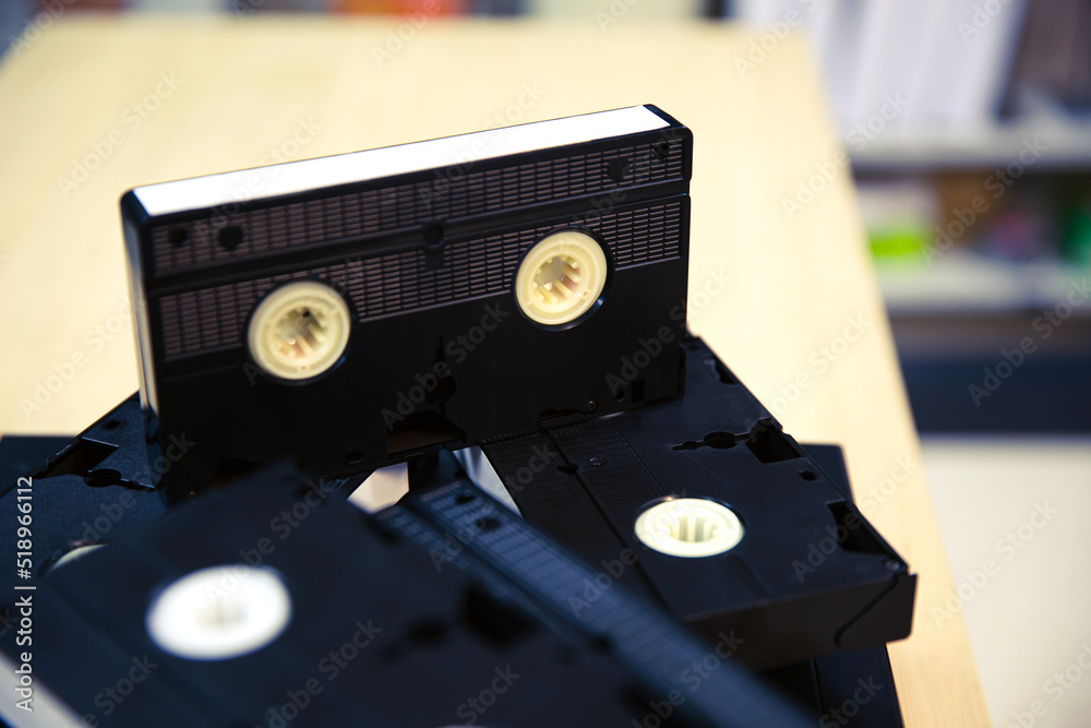 Video cassette tapes VHS in the video tape player and pile stack