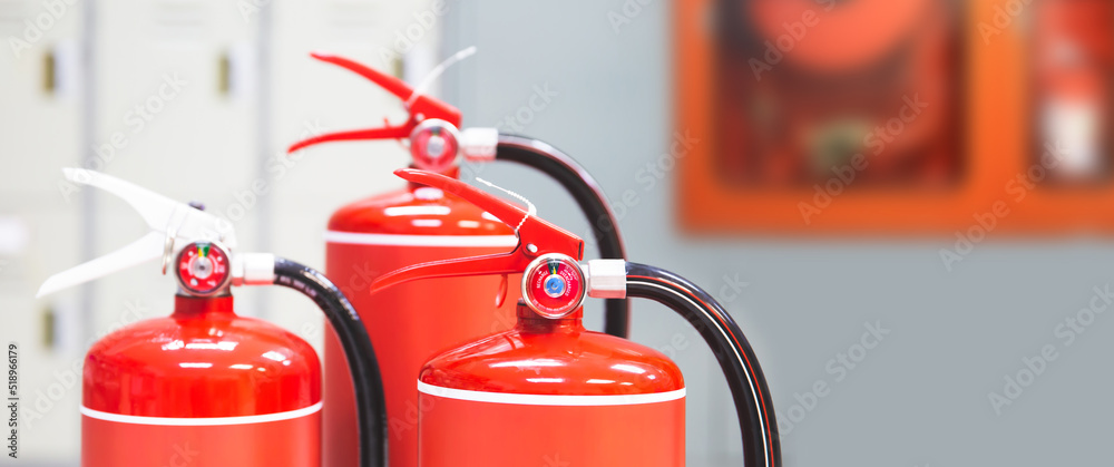 Fire extinguisher, Close-up red fire extinguishers tank in the building for fire equipment for extinguishing or protection and prevent for emergency and safety rescue and alarm system training.