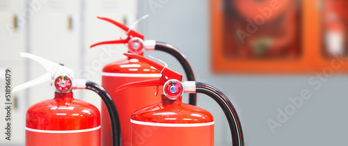 Fotografiet Fire extinguisher, Close-up red fire extinguishers tank in the building for fire equipment for extinguishing or protection and prevent for emergency and safety rescue and alarm system training