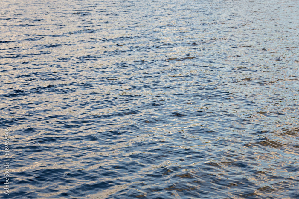 The turbulent surface of the water on the lake as a background. The turbulent surface of the water on the lake as a background.