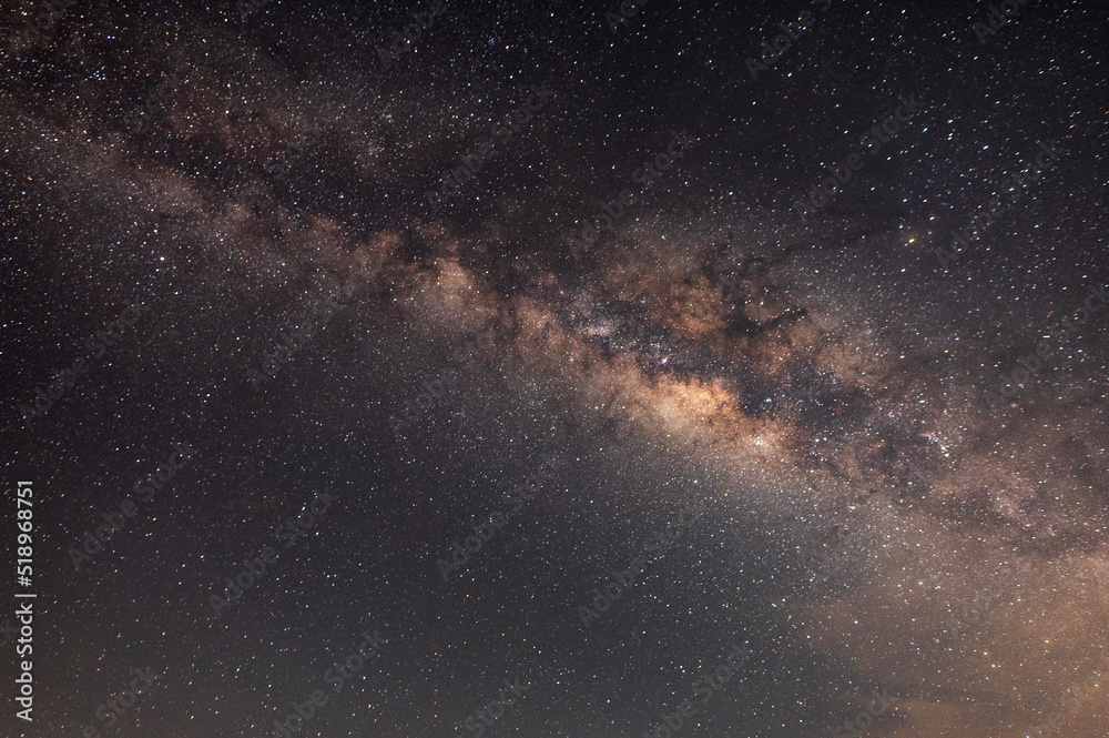 Milky way star on dark night.Deep sky on Universe. with noise and grain.Photo by long exposure and select white balance,Warm tone. Milky way star on dark night.Deep sky on Universe. with noise and grain.Photo by long exposure and select white balance,Warm tone.