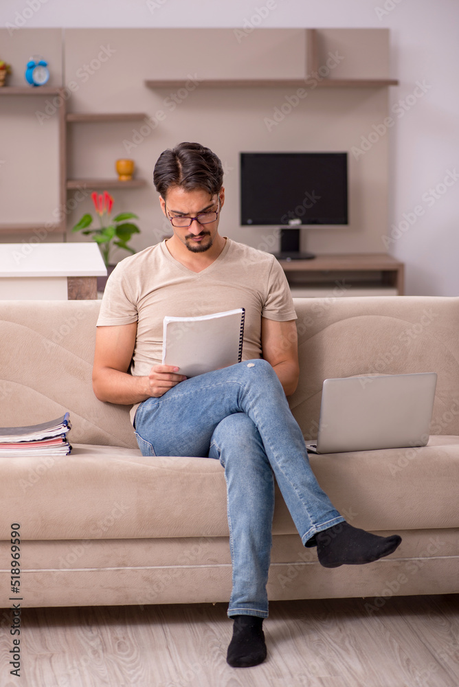 Young male employee working from house Young male employee working from house