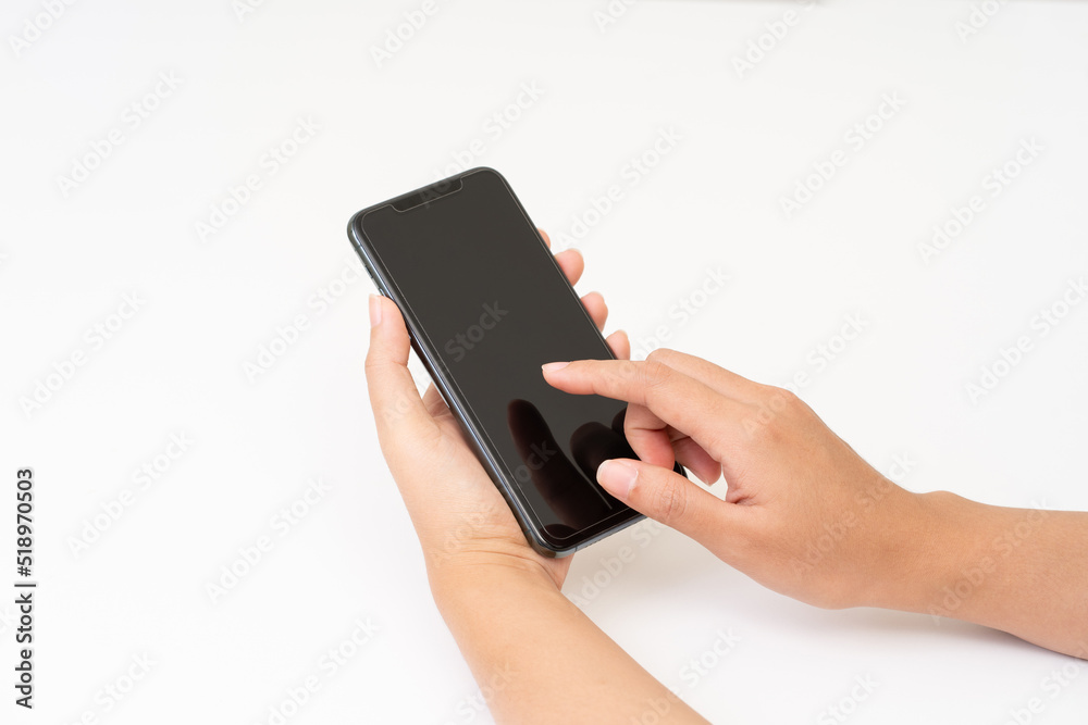 Women hands holding smartphone on white background. Women hands holding smartphone on white background.