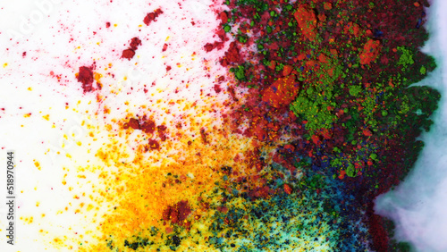 Top view of dry green, yellow and red inks floating in white milky substance. Media. Beautiful iridescent background with colorful paints mixed with white colored liquid.