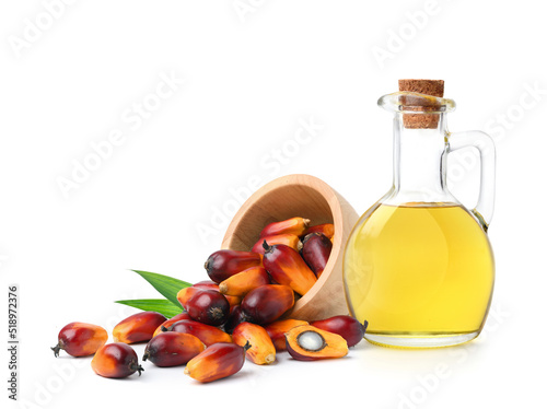 Palm oil with fresh palm nuts on isolated on white background. photo