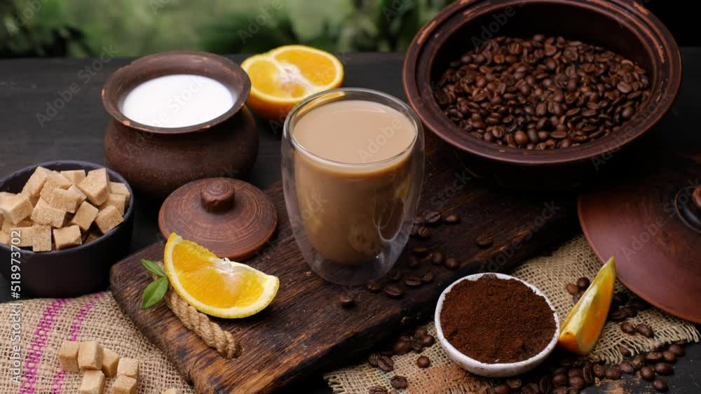 Breakfast with cappuccino, orange. Close-up 4k video shooting, dark background Breakfast with cappuccino, orange. Close-up 4k video shooting, dark background