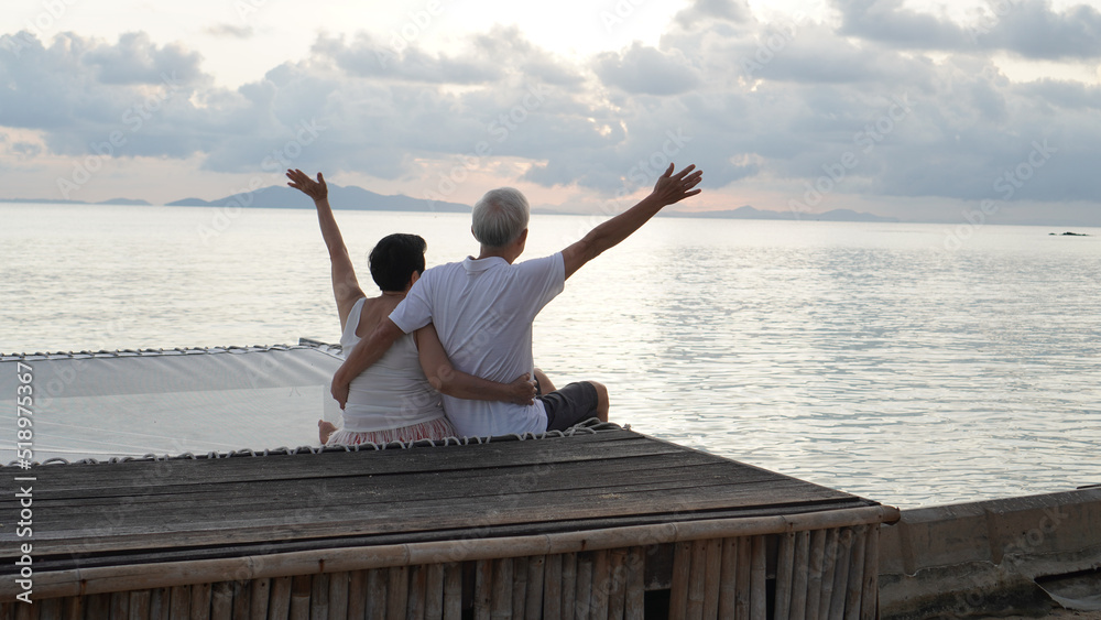Asian senior elder couple relax enjoy have fun on tropical seaside morning vacation retirement trip Asian senior elder couple relax enjoy have fun on tropical seaside morning vacation retirement trip