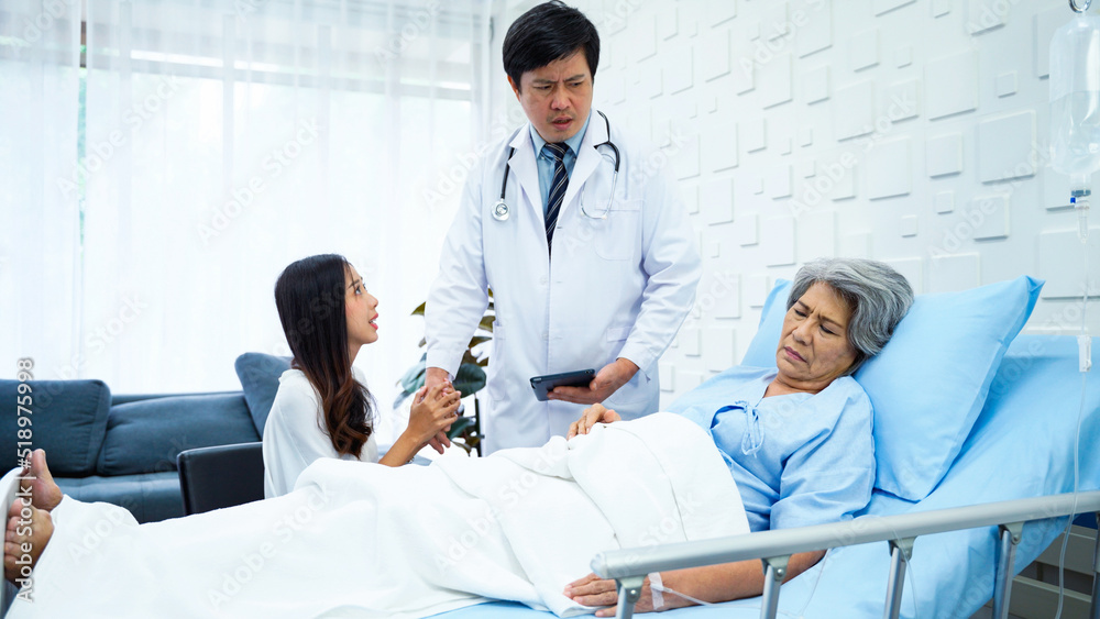 Fototapeta premium Specialist male doctor came to report the worsening symptoms of elderly female patients. The female patient's daughter asked a male doctor to help her mother to the best of his ability. 