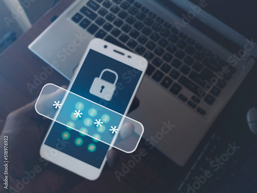 Cybersecurity essentials on smartphones. Digital cyber crime by anonymous hackers. Men hand holding a phone on a laptop with 3d icons password for personal data security and finance.