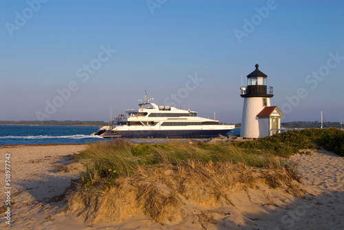 Ferry Passes By Lighthouse on Nantucket Island Off Cape Cod