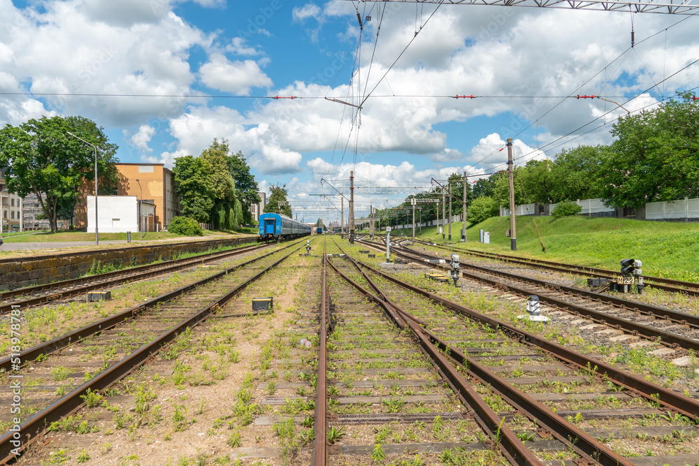 Railway and sleepers close-up. A major railway interchange near the station for train traffic, logistics between cities, cargo transportation. Railway and sleepers close-up. A major railway interchange near the station for train traffic, logistics between cities, cargo transportation.