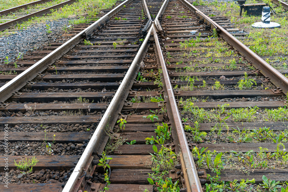 Railway and sleepers close-up. A major railway interchange near the station for train traffic, logistics between cities, cargo transportation. Railway and sleepers close-up. A major railway interchange near the station for train traffic, logistics between cities, cargo transportation.