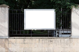 Horizontal rectangular billboard on the fence of the park. Mock-up.
