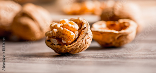 Walnuts kernels on wood desk with detail background,  walnut on wood kitchen underlay.