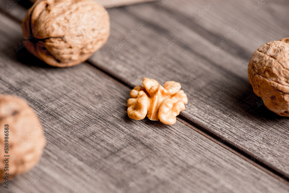 Walnuts kernels on wood desk with detail background, walnut on wood kitchen underlay. Walnuts kernels on wood desk with detail background, walnut on wood kitchen underlay.