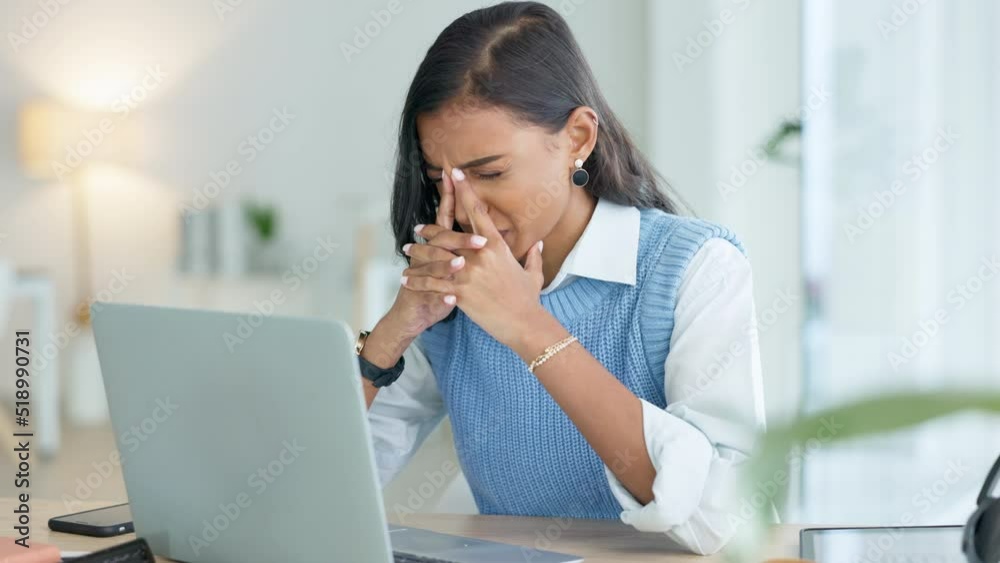 One student with burnout looking unhappy while trying to meet a deadline for a task. Young female intern suffering from a headache while typing an email on a laptop in an office alone at work One student with burnout looking unhappy while trying to meet a deadline for a task. Young female intern suffering from a headache while typing an email on a laptop in an office alone at work