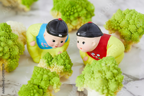 Romanesco broccoli with two Chinese figures