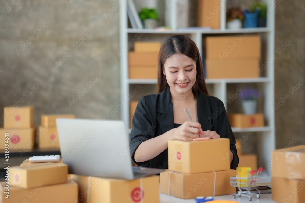 Online business owner Asian woman are using computer to check orders and customer addresses so that they can be delivered to their customers correctly.