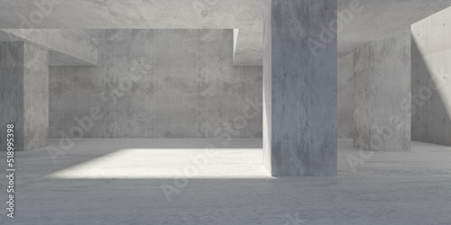 Abstract large  empty  modern concrete room  sunlight shadow  pillar in the center and rough floor - industrial interior background template