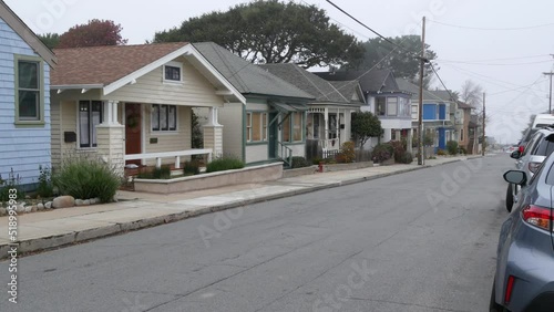 Row of old victorian style houses, historic residential district, Monterey, California USA. Colonial architecture, retro vintage suburban wooden classical cottages. Real estate property, city street.