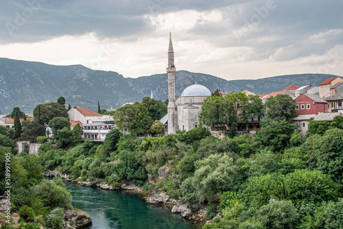 View on Nerteva River and Old City of Mostar with Ottoman Mosque; Mostar in Bosnia and Herzegovina. 