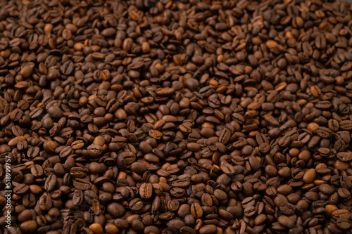 Roasted brown coffee beans background.