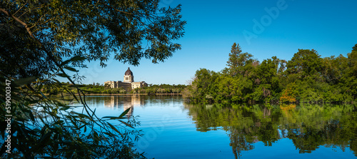 Tranquil Wascana Lake and Forest Park landscape in Regina, Saskatchewan, Canada, with the view of the Saskatchewan Legislative Building. photo