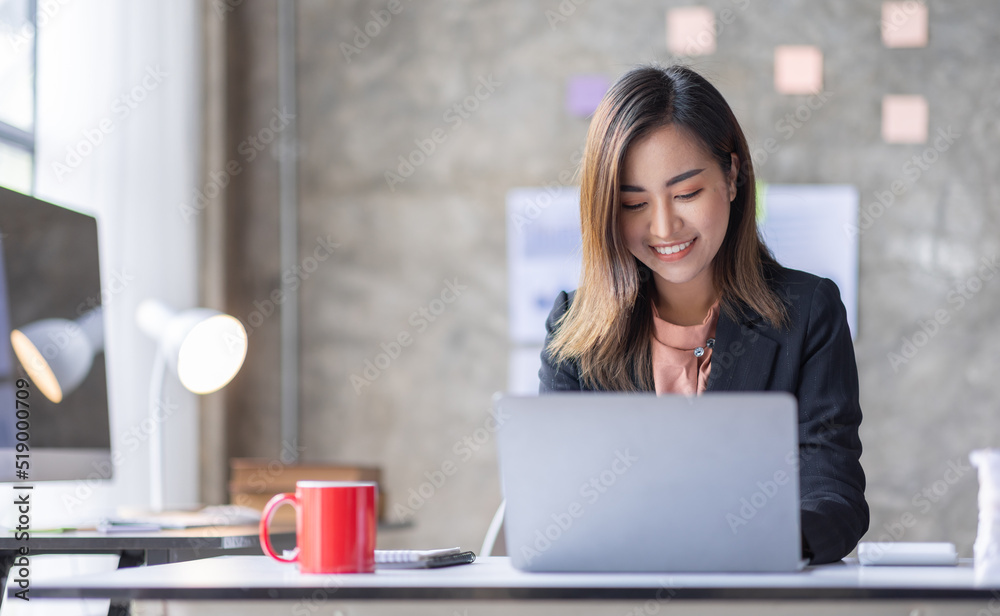 Fototapeta premium Business Accountant Young Asian female working on a laptop, doing calculator planning analyzing the financial report, business plan investment, finance analysis concept 
